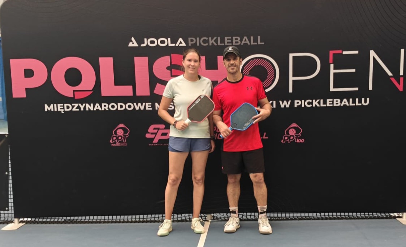 Zawodniczka i zawodnik z rakietkami podczas Polish Open